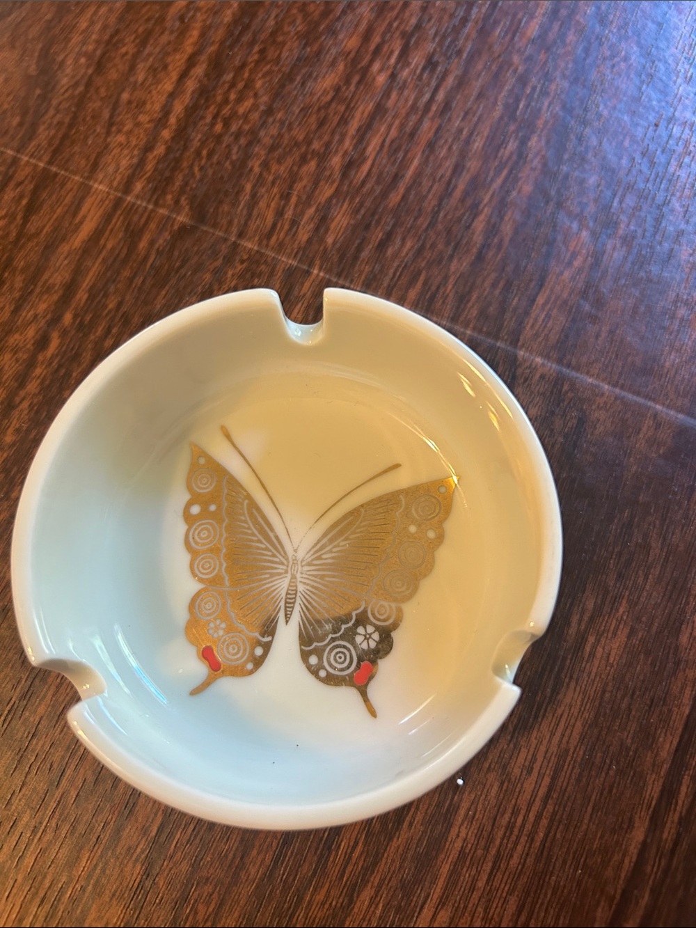 Vintage ashtray with gold butterfly